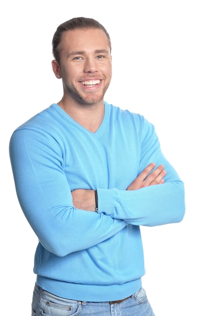 Knappe jonge man in blauwe trui