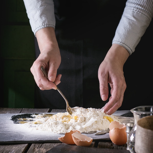 Knead the dough by female hands