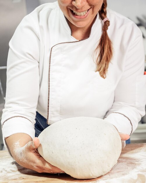 Kneading and preparation of sourdoughbased bread On a wooden table in bakery