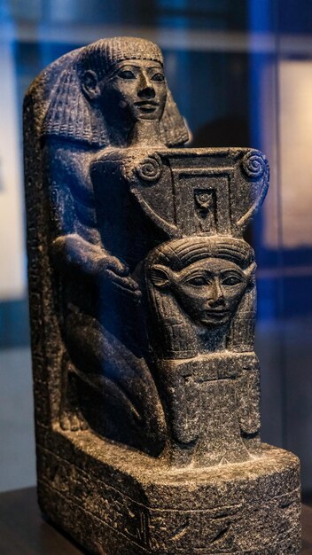 Kneeling portrait statue of Senenmut in a museum in Germany