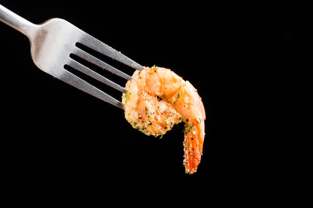 Knife and fork fork a delicious shrimp