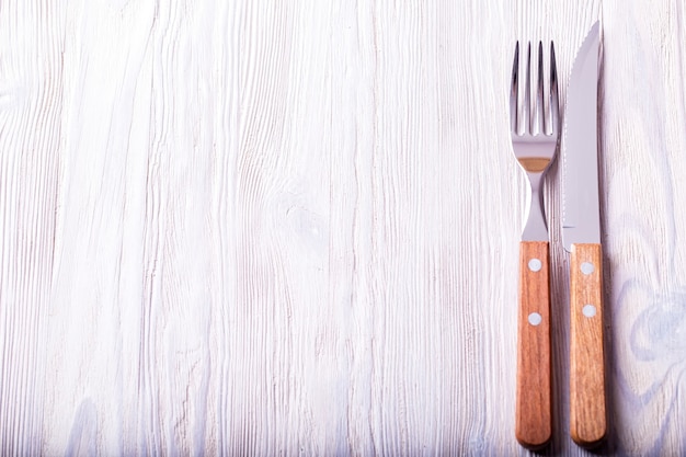 Knife and fork with the wooden handle.