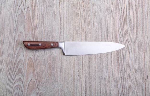 Knife on rustic kitchen table