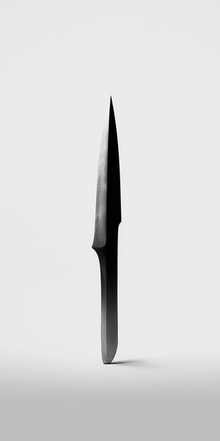 Photo a knife with a black blade in the middle of it.