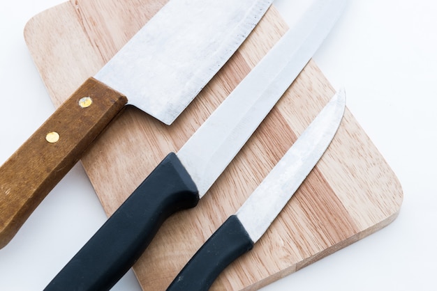 Knife on wooden chopping board