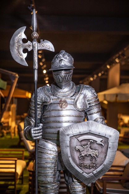 a knight statue with a shield and a sword