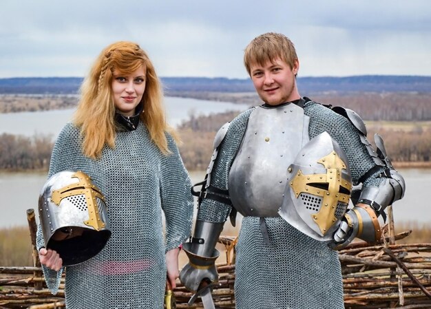 Photo knight with his wife in armor and chain mail