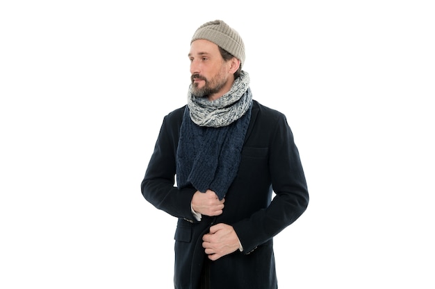 Knitted accessories. Mature man cold winter weather style. Winter collection. Man enjoy warmth and comfort. Casual coat for cold winter conditions. Handsome guy wearing hat and scarf white background.