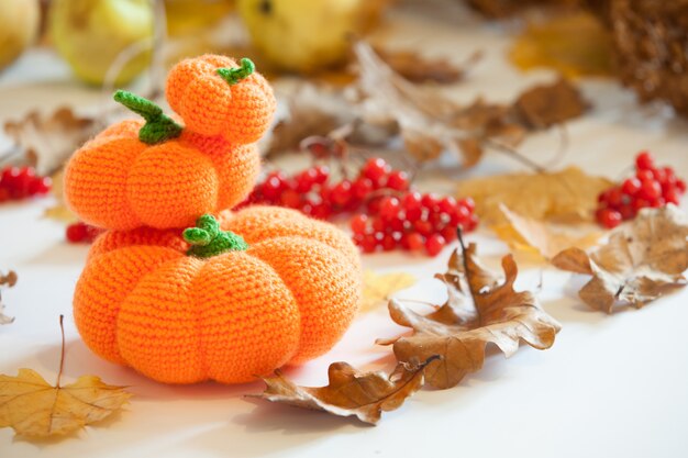 Knitted amigurumi pumpkins and bats on Halloween