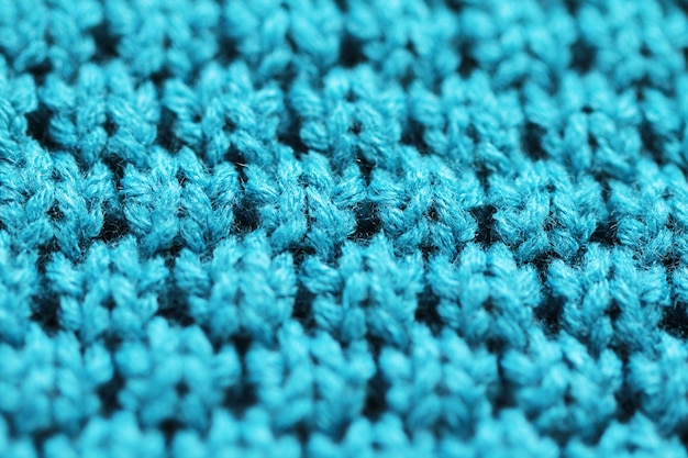 Knitted background close up of blue color