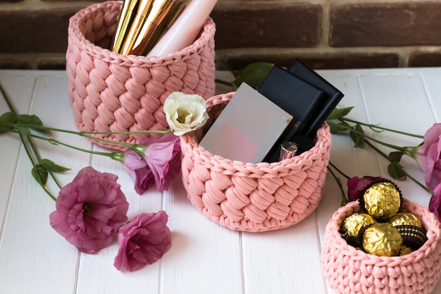 Knitted basket of knitted yarn peach color