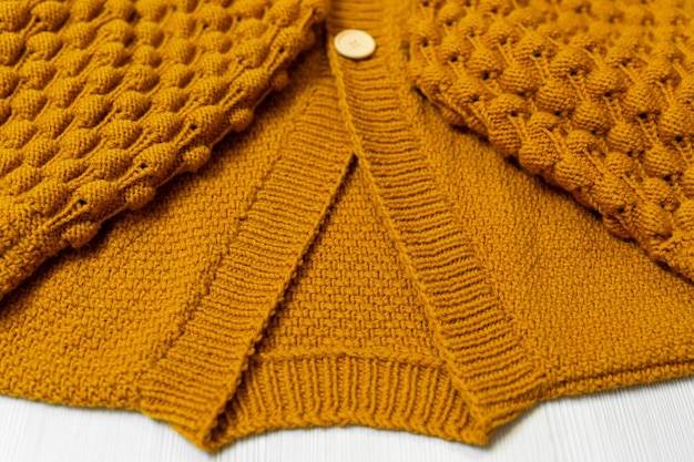 Knitted children's sweater on a white background