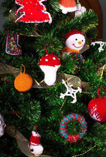 Knitted christmas toys on the christmas tree