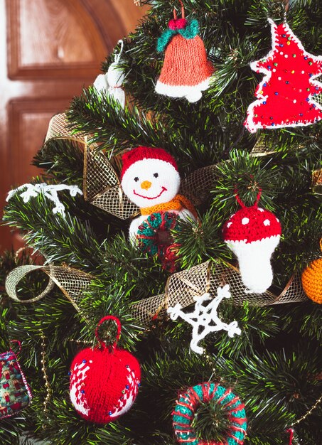 Knitted christmas toys on the christmas tree