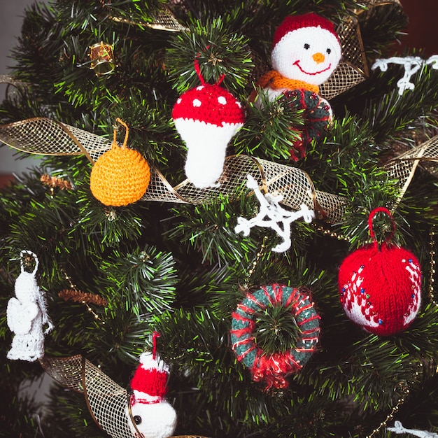 Knitted christmas toys on the christmas tree