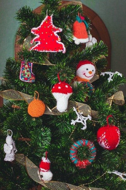 Knitted christmas toys on the christmas tree