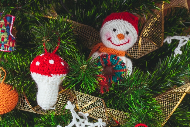 Knitted christmas toys on the christmas tree