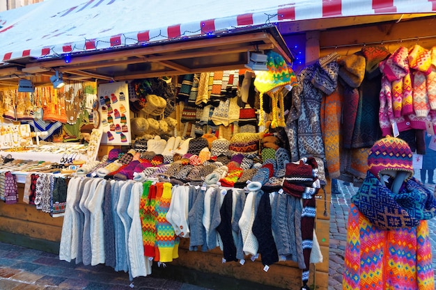 Knitted goods displayed on a Christmas market stall for sale. Old Town of Riga, Latvia