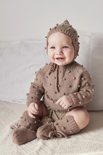 Knitted kids clothes and accessories for knitting Needlework and knitting Hobbies and creativity Knit for children Handmade Hobbies and creativity Toddler boy in knitted clothes and cap