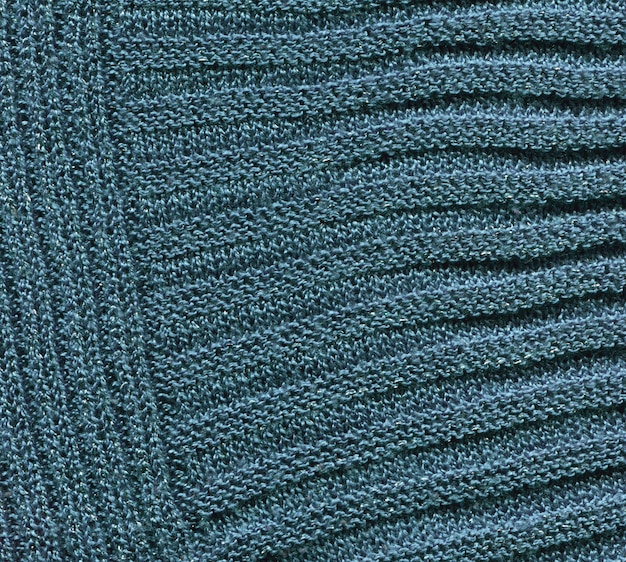 Текстура трикотажа из натурального текстиля голубого синего свитера