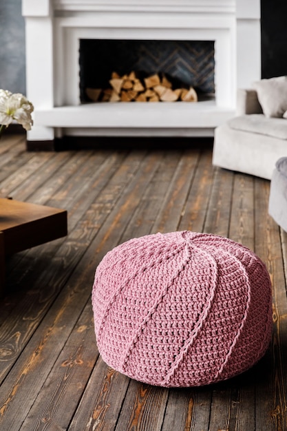 Knitted pouf on a modern living room