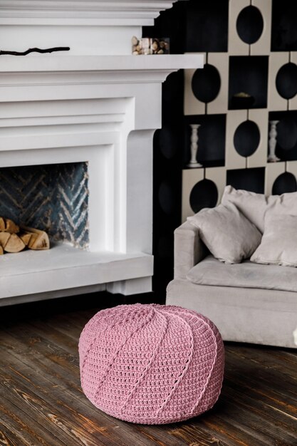 Knitted pouf on a modern living room