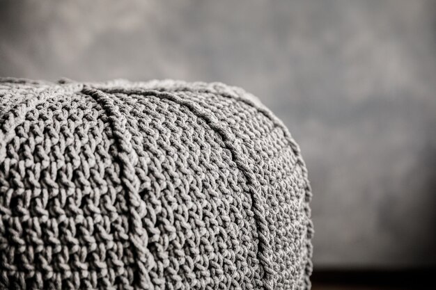 Knitted pouf on a modern living room