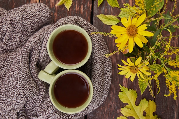 Knitted scarf with warm  cup of tea