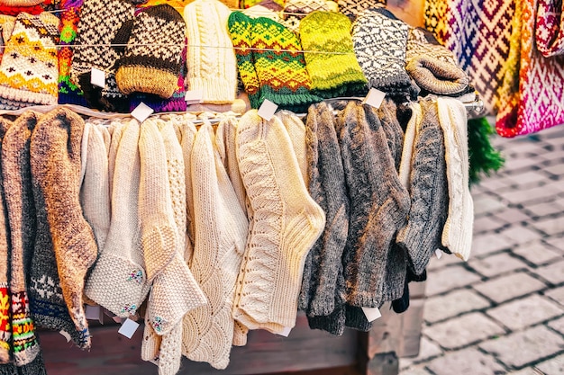 Knitted socks souvenirs on stalls at Christmas market in Riga in Latvia in winter.