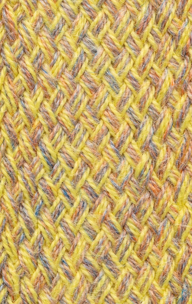 Knitted Textile texture off colored background.