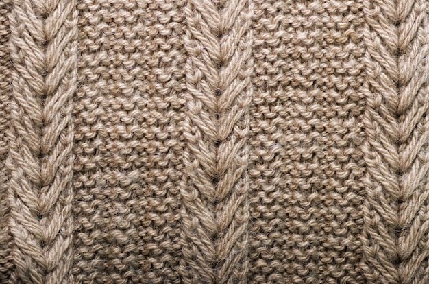 Knitted texture. Pattern fabric made of wool. 