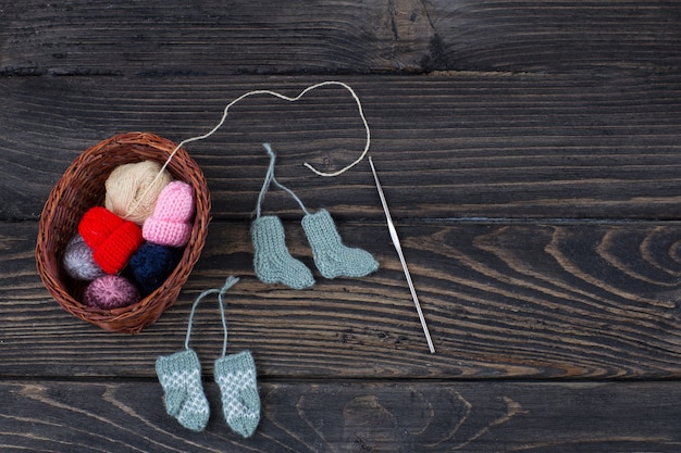  knitted things: socks, mittens, hats, hook and ball of thread