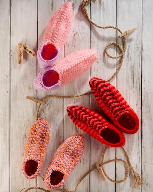 Knitted wool socks on a wooden white background