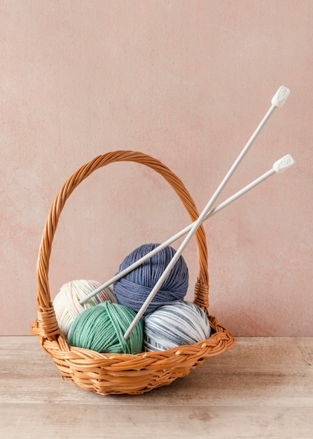 Photo knitting needles and wool in basket