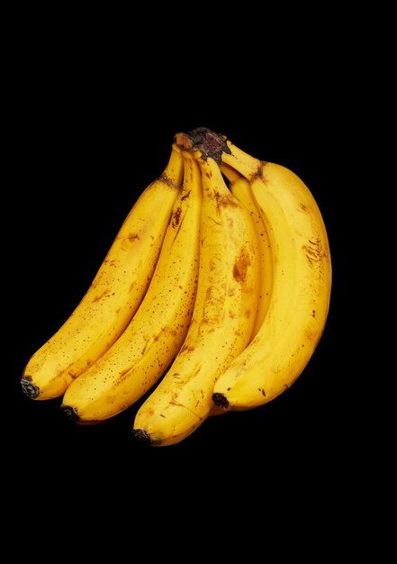 Knitting of very ripe bananas on a black backgroundxA