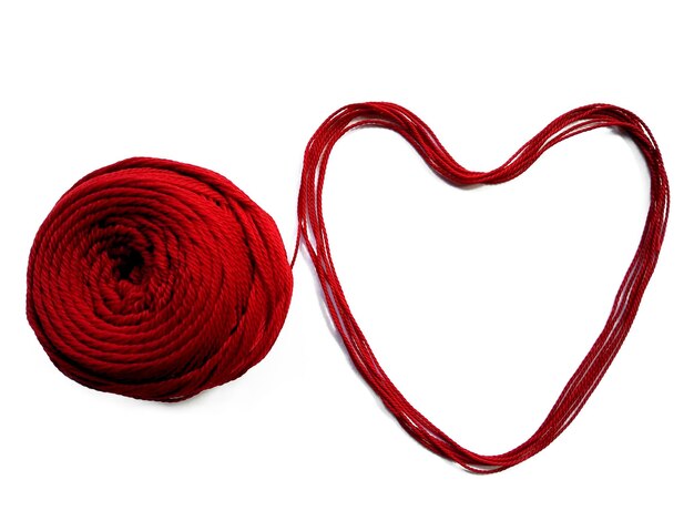 Knitting yarn heart shaped isolated on white background