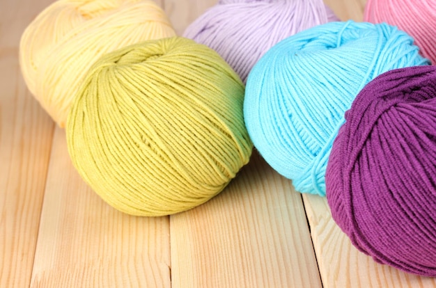 Knitting yarn on wooden background