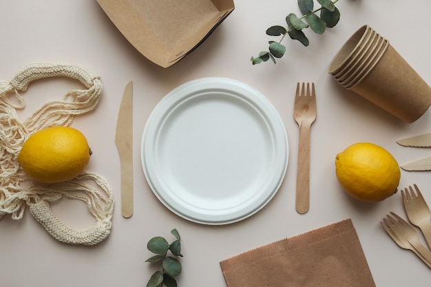 Knives, forks, empty plate, string bag and paper bag. zero waste concept