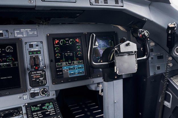 Knobs and buttons Close up focused view of airplane cockpit