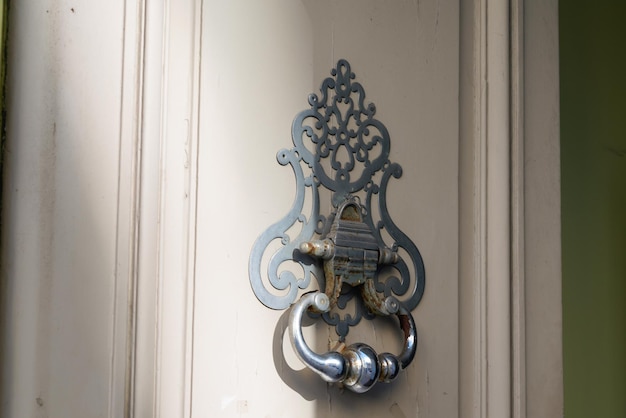 Knocker on the wooden door classic antique entrance