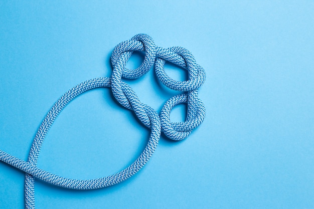 Knots on a rope on a blue background.