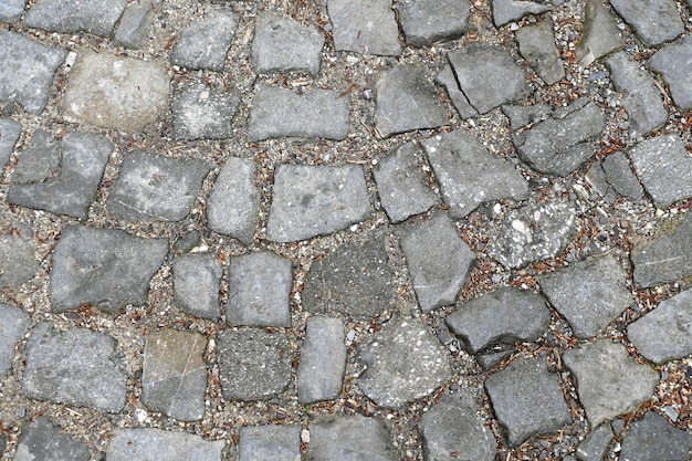 Foto kobblestone trottoir in de stad kobblestone straat oppervlak bij zonsondergang