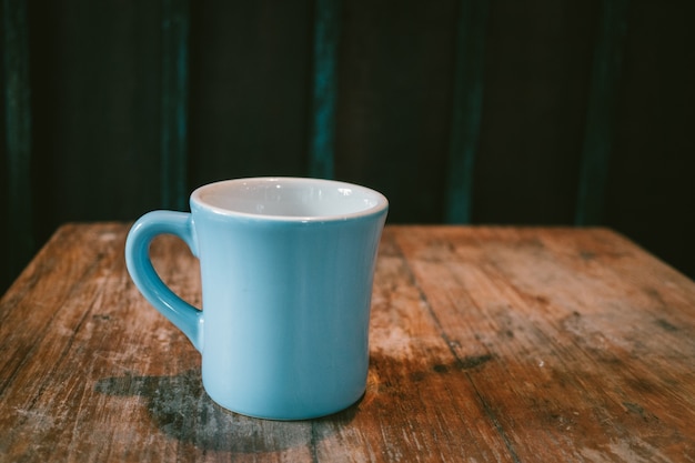 Koffie kop op houten tafel achtergrond