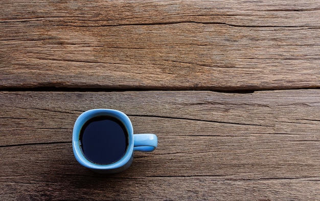 Koffie kop op houten tafel achtergrond