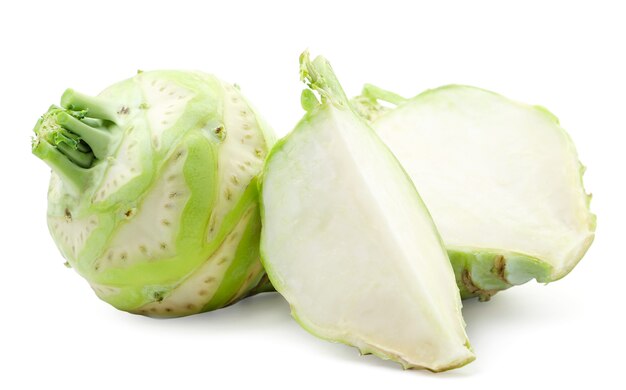 Kohlrabi cabbage whole, half and a piece close-up on a white background. Isolated