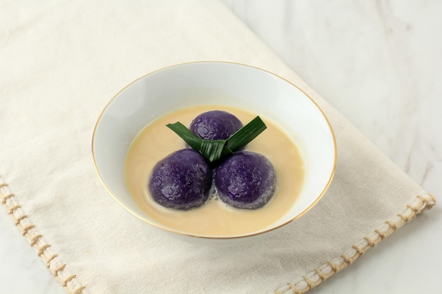 Kolak Candil Ubi Ungu or Purple Sweet Potato Glutinous Rice Balls with Pandan Palm Sugar and Coconut Milk Sauce