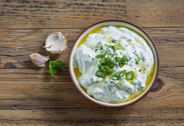 Kom zure room of Griekse yoghurt