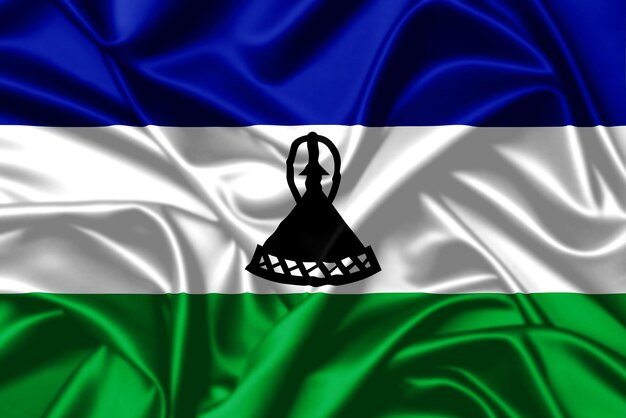 Koninkrijk Lesotho zwaaiende vlag close-up satijn textuur achtergrond