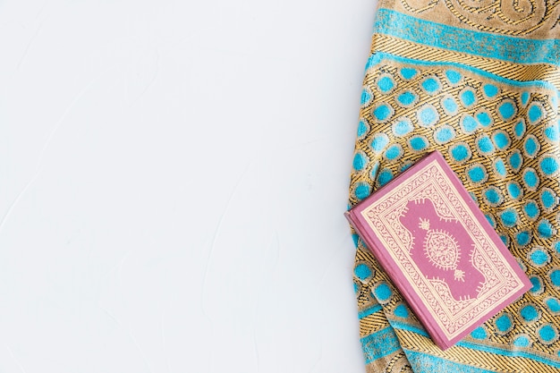 Koran book and traditional carpet