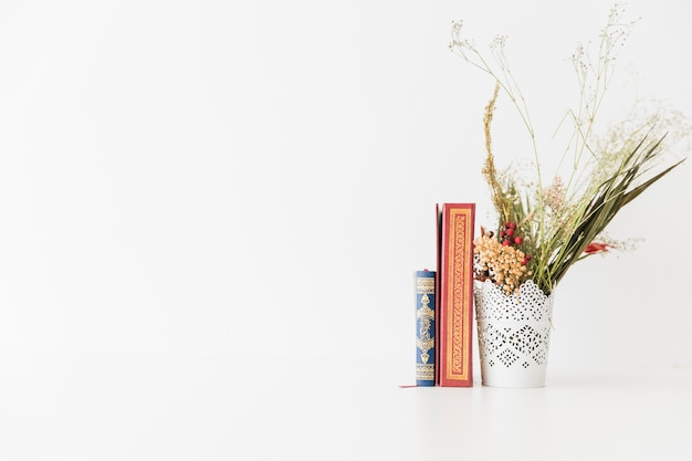 Koran books and bunch of flowers